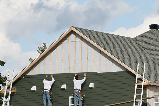 Professional Siding Installation technician working in Highland, MD